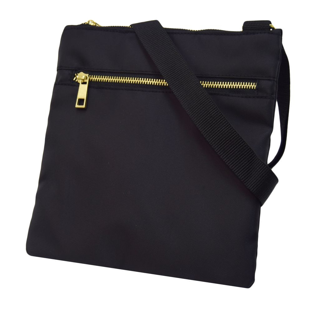 Crossbody Bag in black with brass zipper front pocket and shoulder strap.