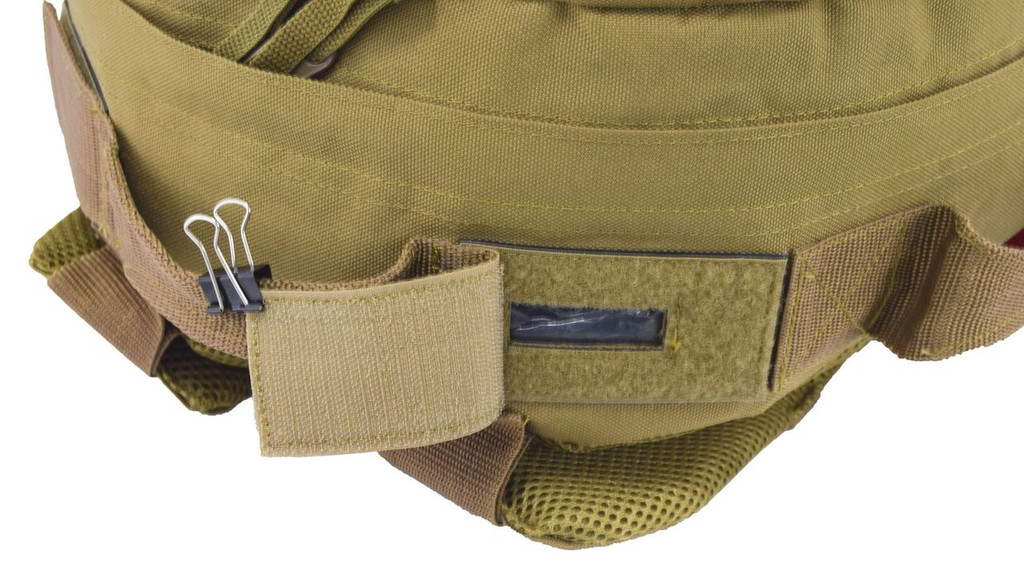 Close up of dual exit ports for hydration tubes on the Pecos Tactical Backpack in coyote brown.