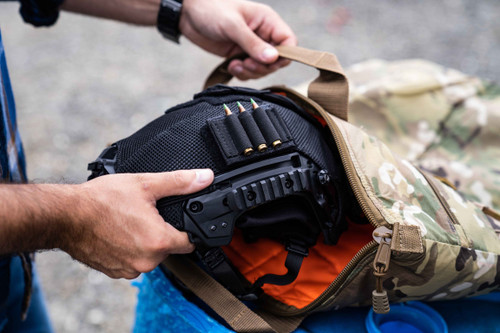 Helmet being placed inside Deluxe Helmet Bag, perfect for carrying and protecting aviation, motorcycle, and other helmets. 