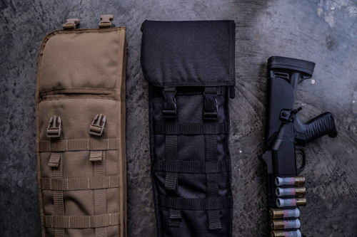 The tops of two Coyote Brown and Black Shotgun Scabbards on a grey surface next to a firearm with ammunition.